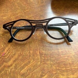Theo pho from Belgium titanium brown frames.